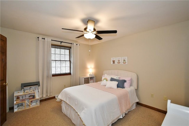 bedroom featuring light carpet and ceiling fan