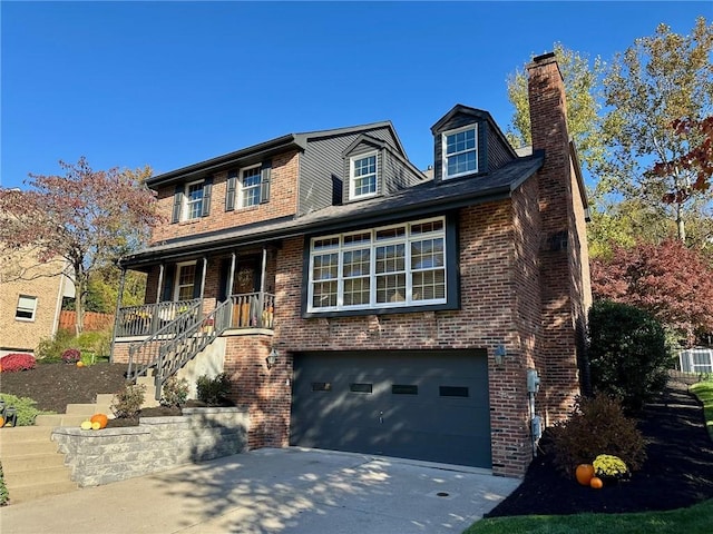 view of front facade with a garage, central AC, and covered porch