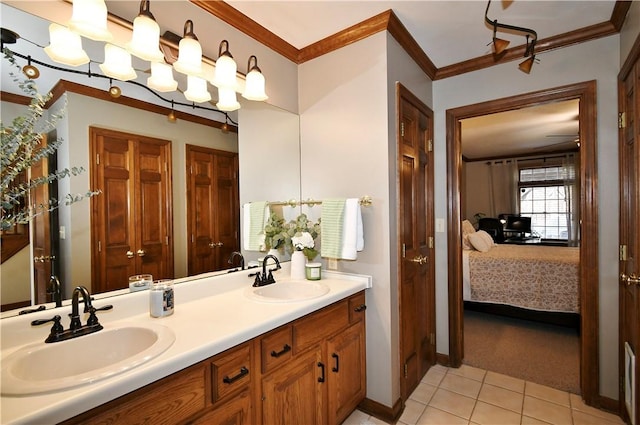 bathroom with tile patterned floors, ornamental molding, and vanity