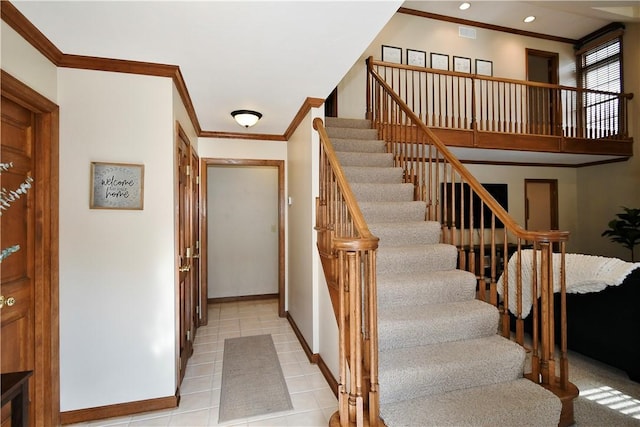 stairs with tile patterned flooring and ornamental molding