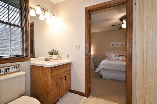 bathroom with ceiling fan, vanity, and toilet