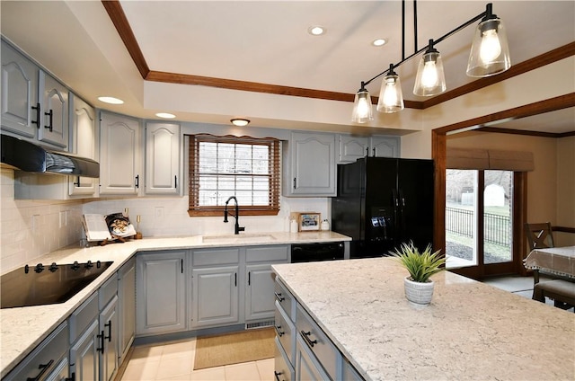 kitchen with sink, hanging light fixtures, tasteful backsplash, ornamental molding, and black appliances