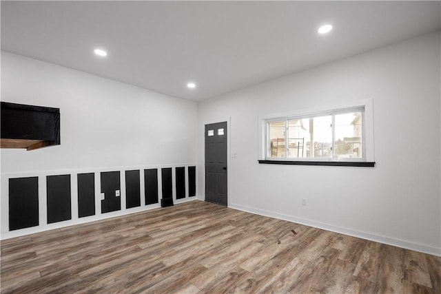 unfurnished room featuring hardwood / wood-style floors