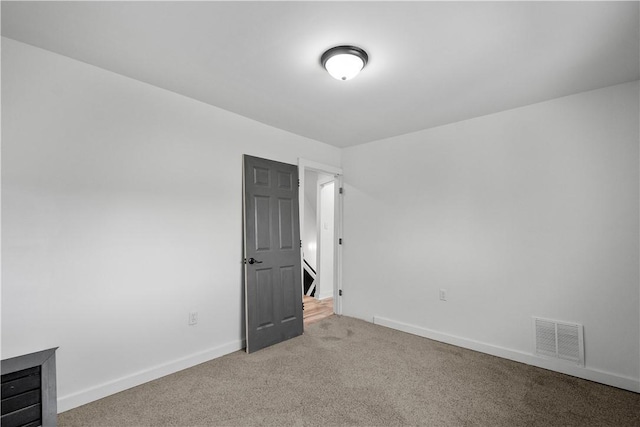 unfurnished room with carpet flooring