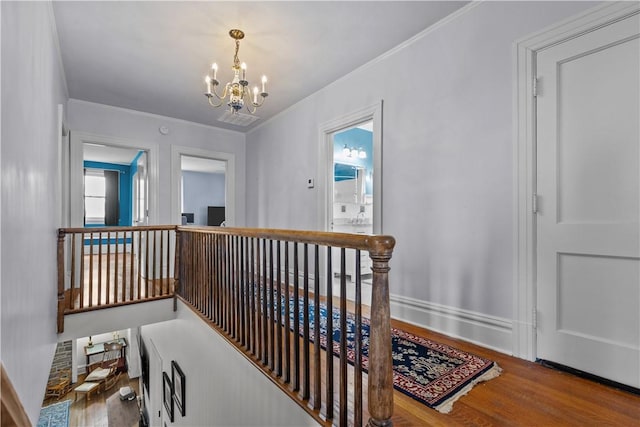 2515 Middle Rd, Hampton, PA 15116 - hallway featuring an upstairs landing, a chandelier, wood finished floors, and ornamental molding