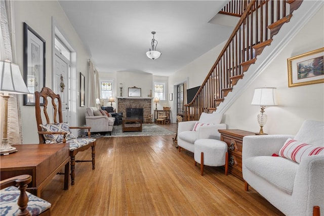 2515 Middle Rd, Hampton, PA 15116 - living room with a fireplace, wood finished floors, and stairs