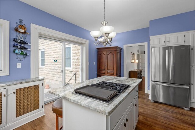 2515 Middle Rd, Hampton, PA 15116 - kitchen featuring freestanding refrigerator, stovetop with downdraft, white cabinetry, a chandelier, and dark wood finished floors