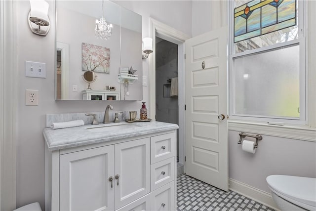 2515 Middle Rd, Hampton, PA 15116 - bathroom with toilet, vanity, baseboards, and a chandelier