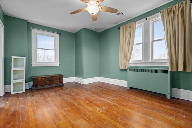 2515 Middle Rd, Hampton, PA 15116 - empty room featuring radiator, hardwood / wood-style flooring, a ceiling fan, and baseboards