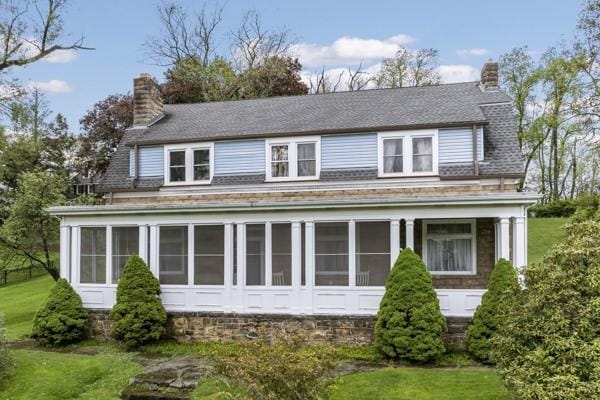 2515 Middle Rd, Hampton, PA 15116 - view of front of home featuring a chimney, a sunroom, a front lawn, and a shingled roof