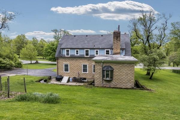2515 Middle Rd, Hampton, PA 15116 - rear view of property featuring a lawn and a chimney