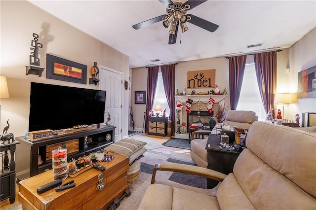 living room with light carpet and ceiling fan