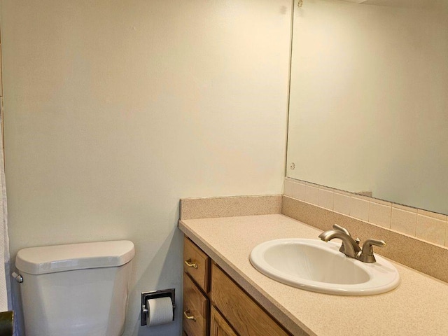 bathroom with vanity and toilet