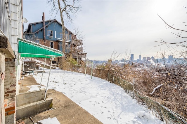 view of yard layered in snow