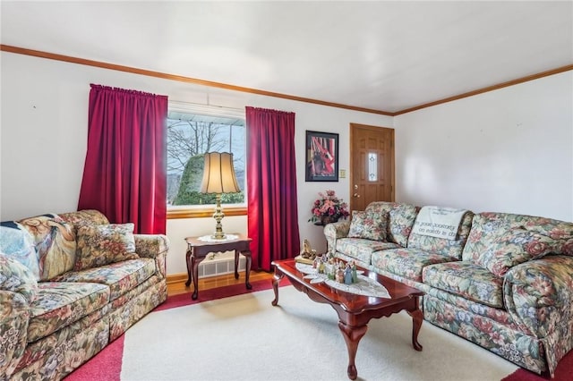 living room with ornamental molding and light colored carpet