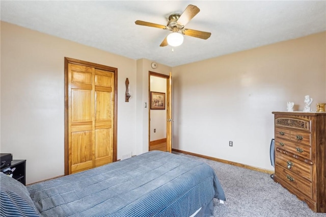 bedroom featuring ceiling fan, light colored carpet, and a closet