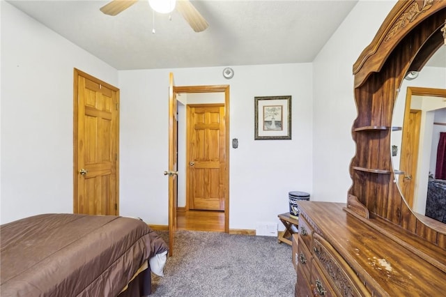 bedroom with ceiling fan and carpet flooring