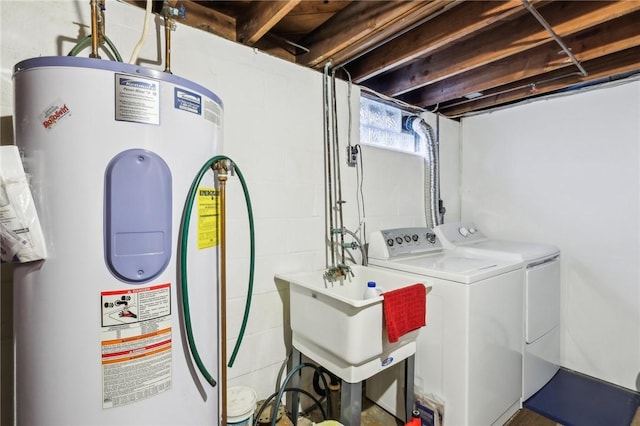 washroom with independent washer and dryer, sink, and electric water heater