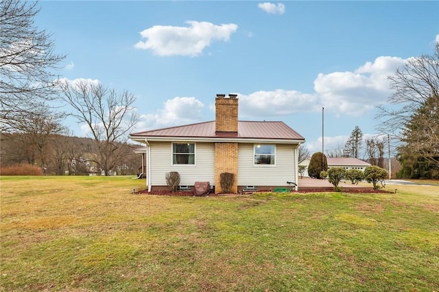 rear view of house with a lawn