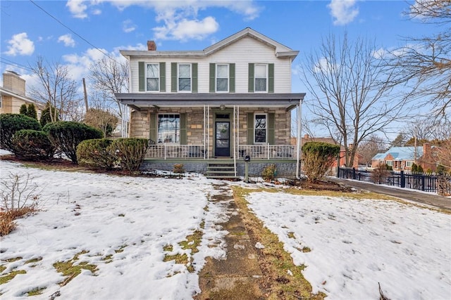 view of front property featuring covered porch