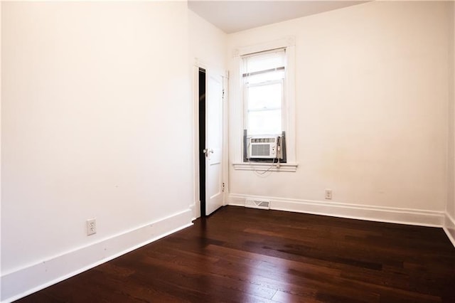 unfurnished room with dark hardwood / wood-style floors