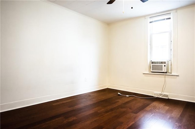 spare room featuring cooling unit, ceiling fan, dark hardwood / wood-style floors, and crown molding