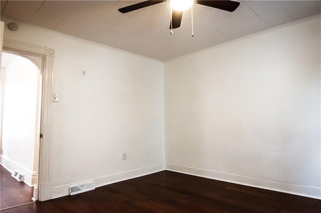 unfurnished room with dark wood-type flooring, ceiling fan, and ornamental molding