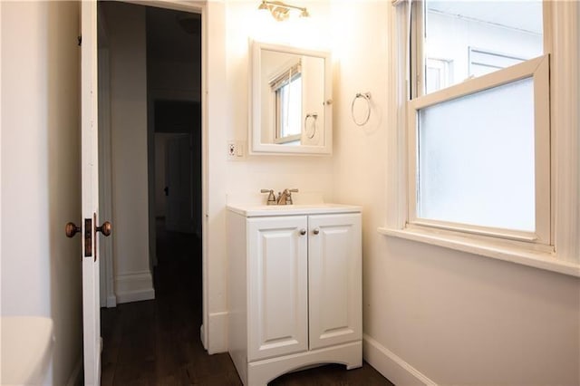 bathroom with vanity and wood-type flooring