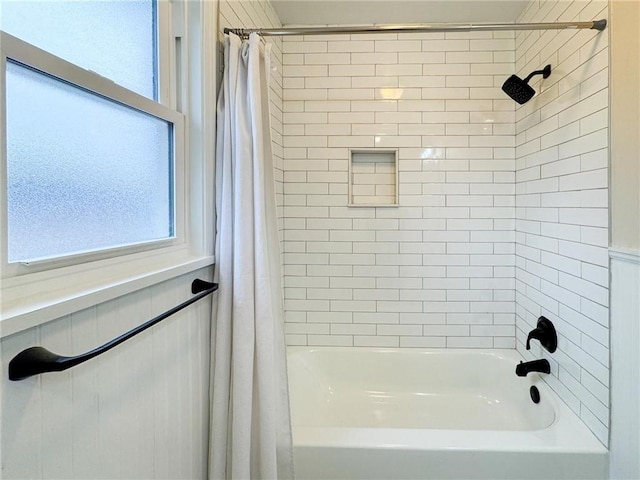 bathroom featuring shower / tub combo with curtain and a wealth of natural light