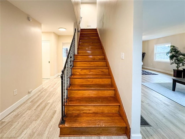 staircase featuring hardwood / wood-style floors