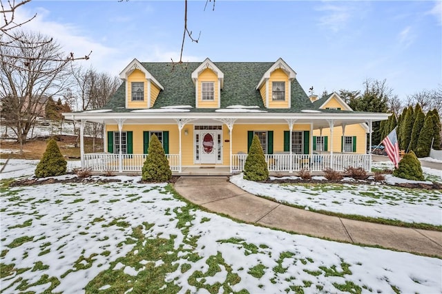 country-style home featuring covered porch