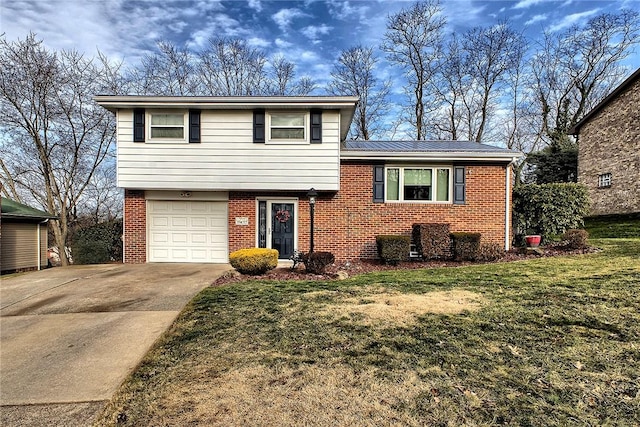 tri-level home with a garage and a front lawn