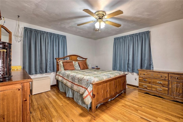 bedroom featuring light hardwood / wood-style flooring and ceiling fan