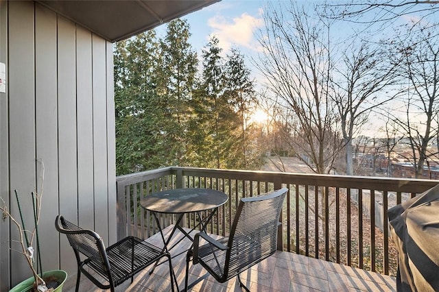 deck at dusk with a grill