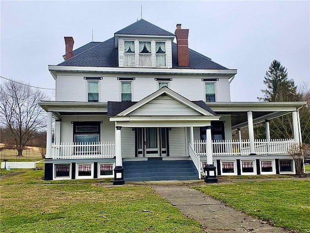 view of front of property with a front lawn and a porch