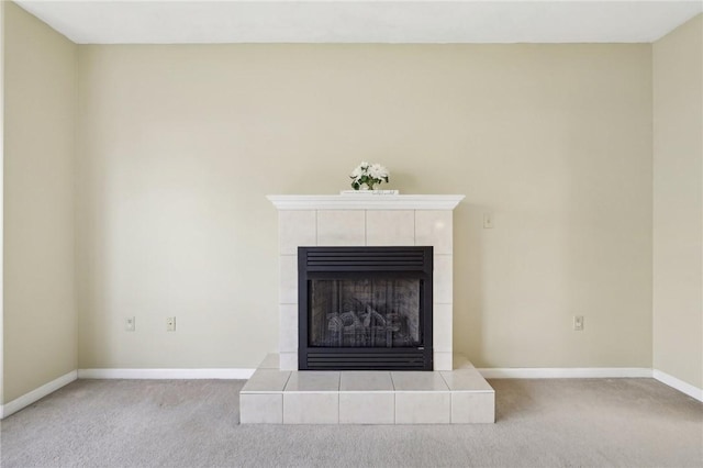 room details with carpet flooring and a fireplace