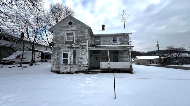 view of front of property featuring covered porch