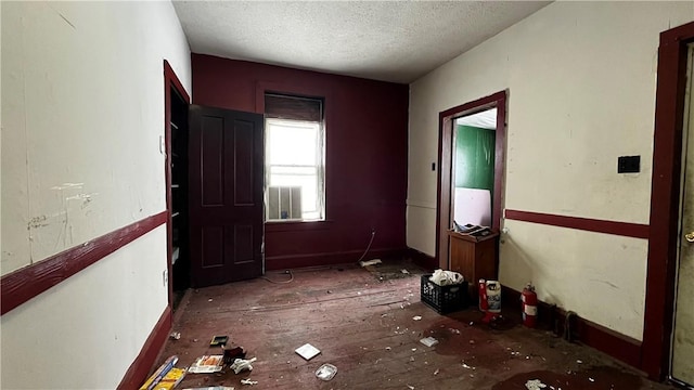 interior space featuring a textured ceiling