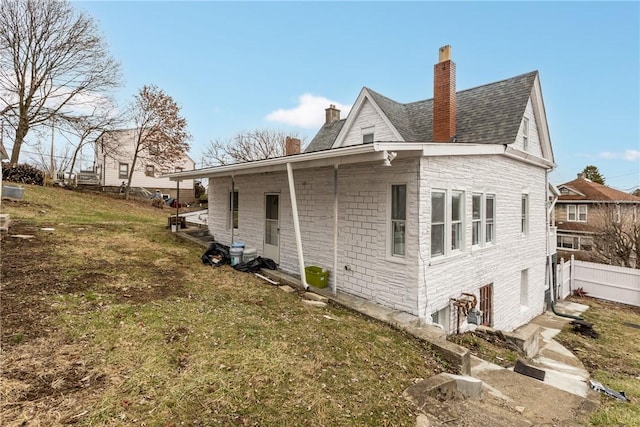 view of side of home featuring a yard