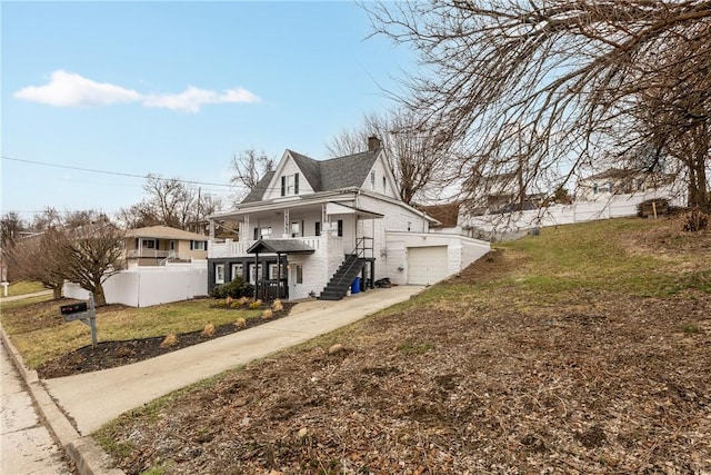 view of home's exterior with a garage and a yard