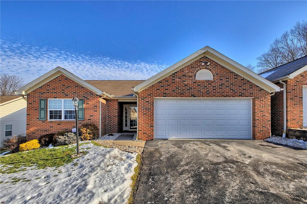 single story home with a garage