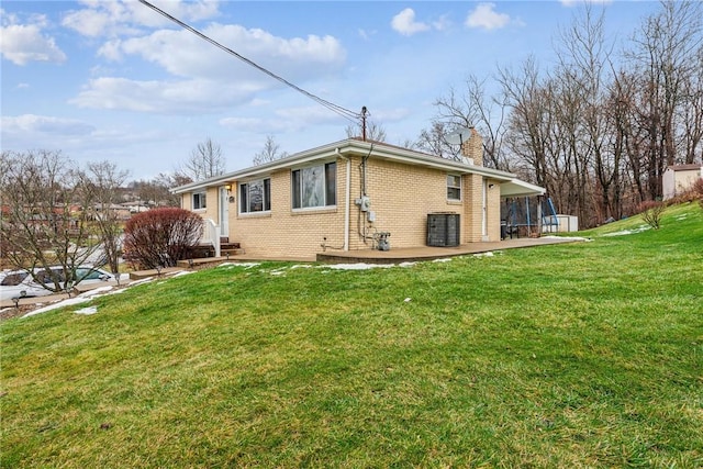 rear view of house with a yard