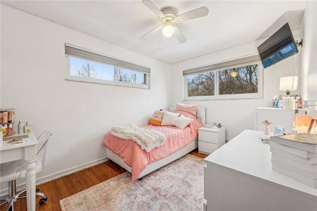 bedroom with wood-type flooring and ceiling fan