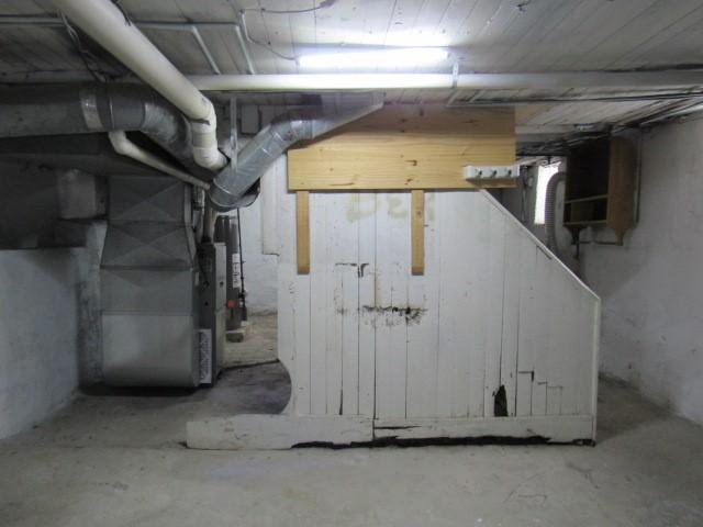 basement featuring heating unit