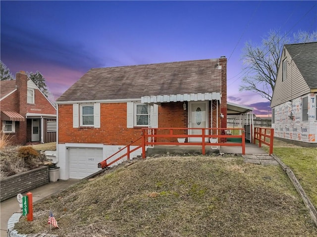 view of front of property featuring a garage and a porch