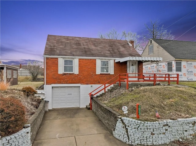 view of front of property with a garage