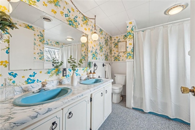 bathroom with vanity, a shower with curtain, and toilet