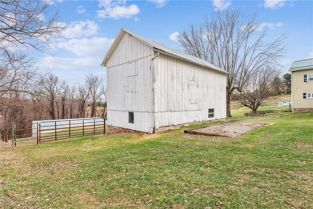 view of outbuilding with a lawn