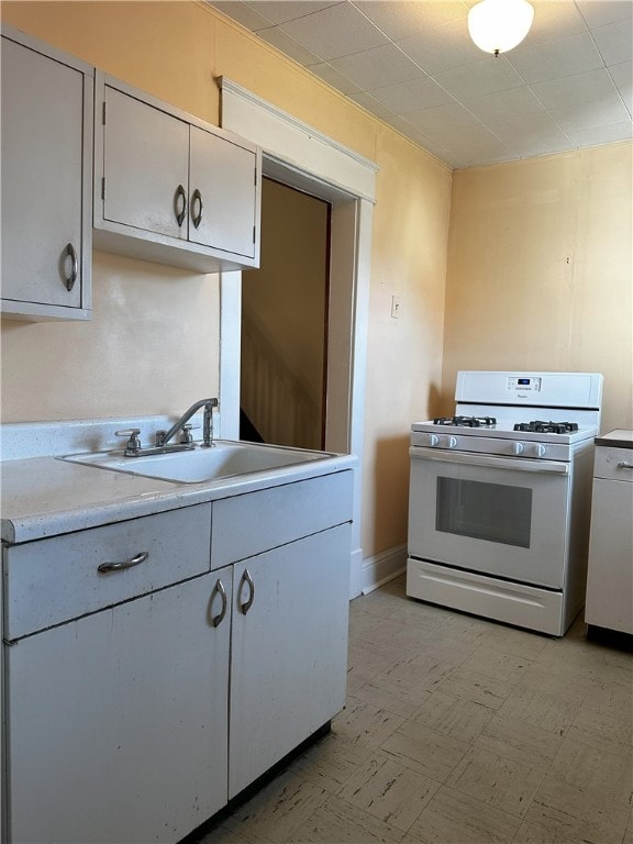 kitchen featuring white appliances and sink