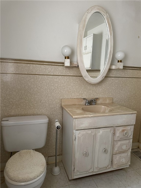 bathroom with vanity and toilet